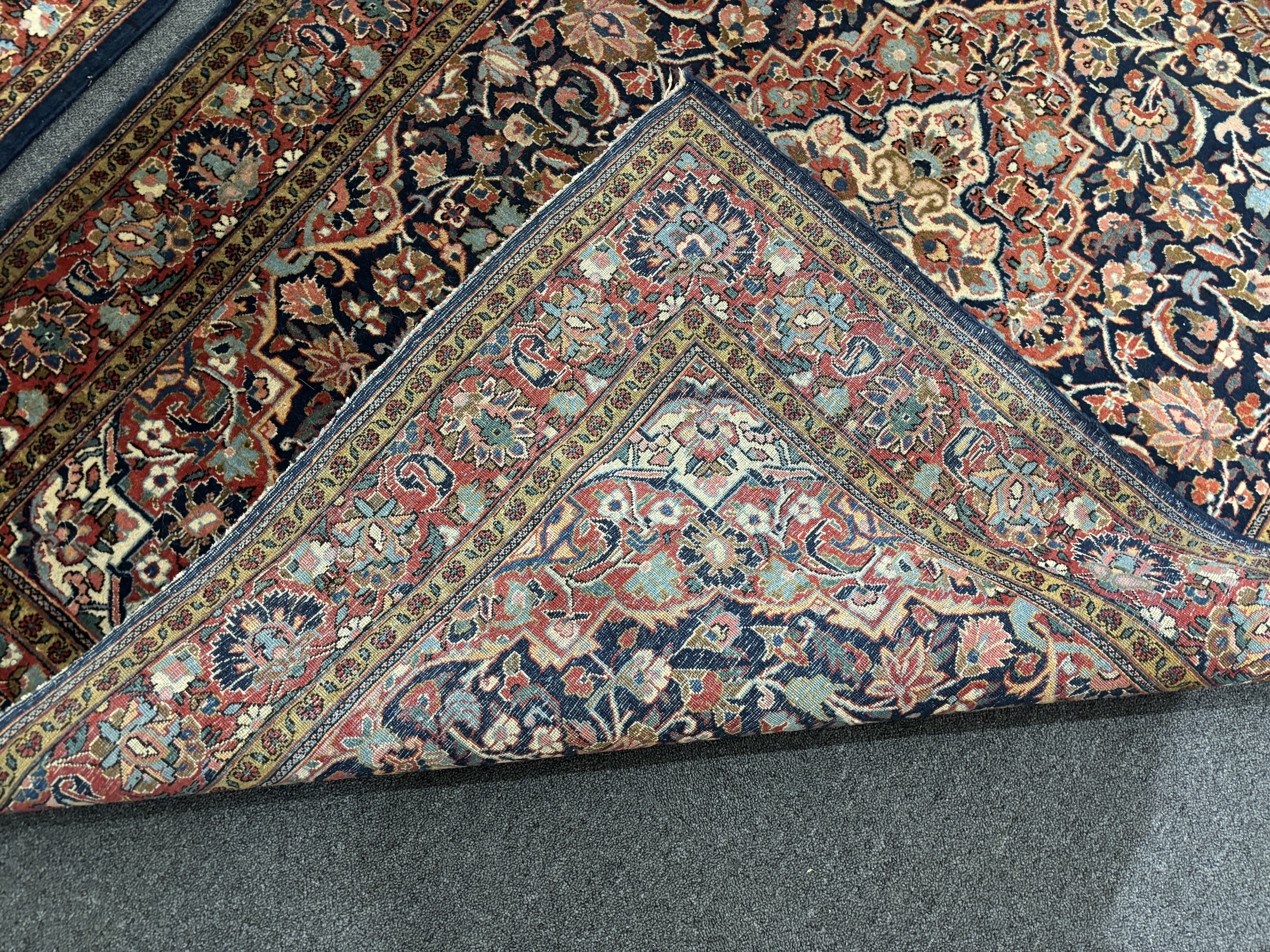 A pair of Kashan blue ground rugs, 216 x 139cm